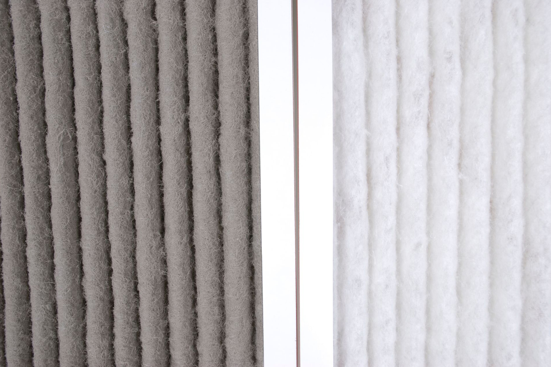 Dirty and clean pleated air filters side by side