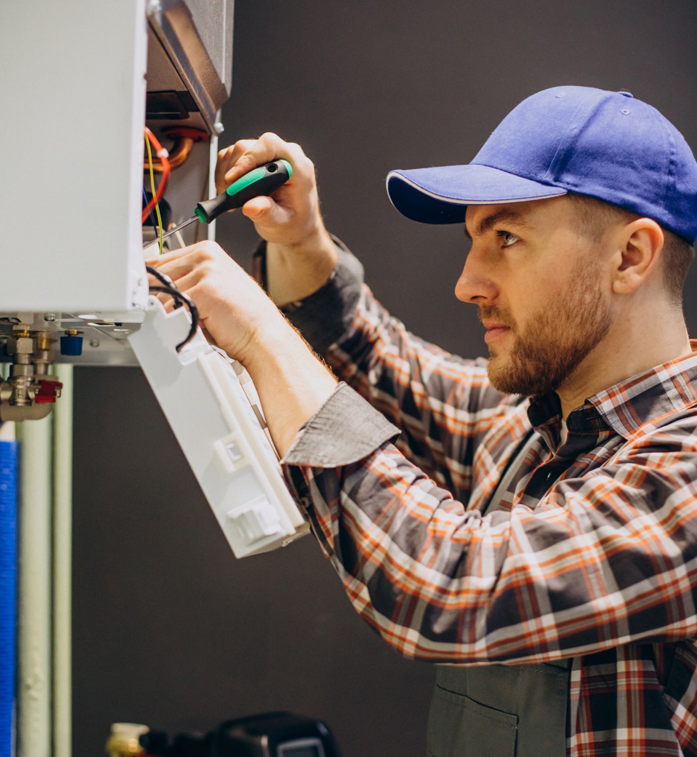 HVAC Technician using advanced tools for furnace diagnostics in Elmira, Ontario - LG Home Comfort