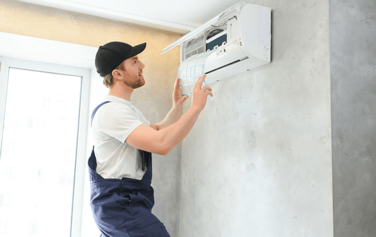 HVAC Technician installing new air conditioning system in Elmira, ON - LG Home Comfort