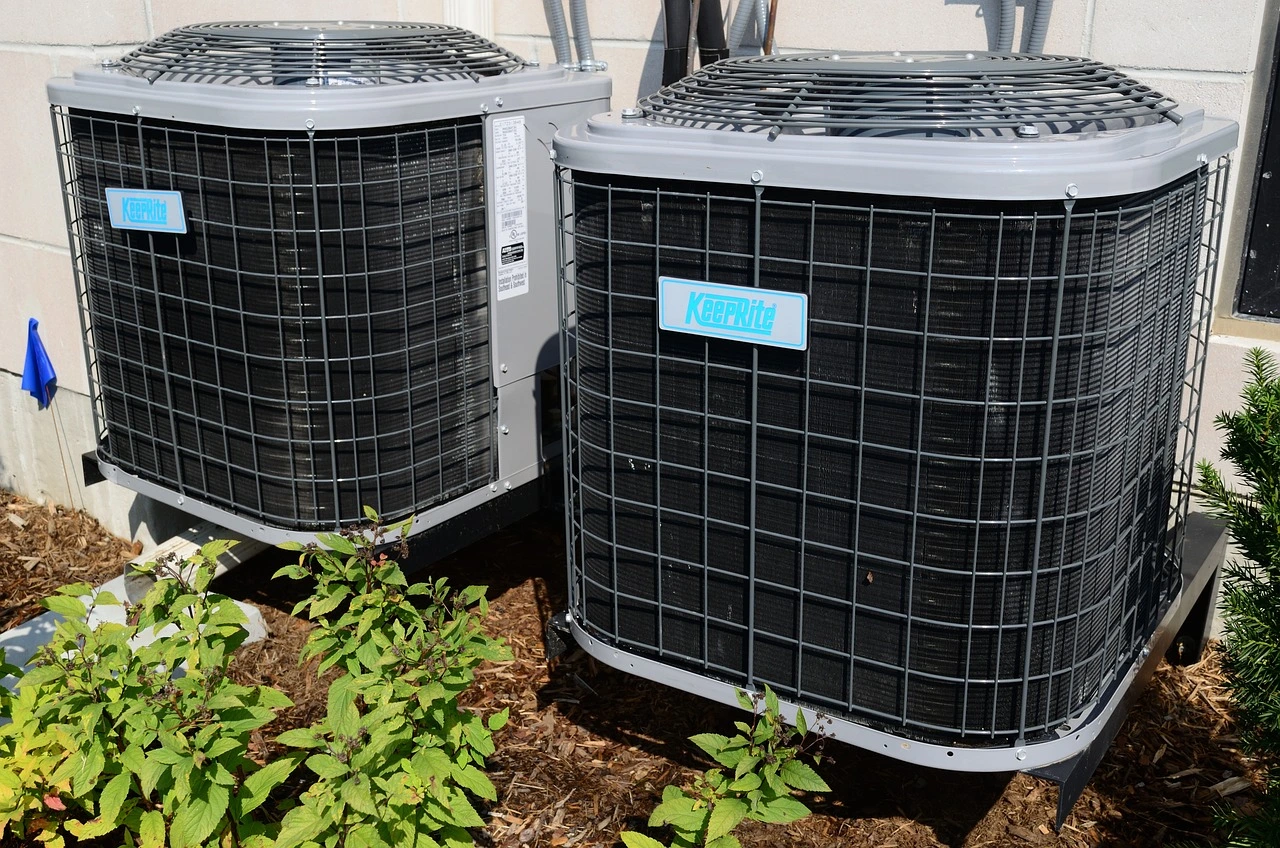 A pair of central air outside units