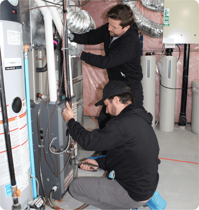 New-furnace-installation-by-technician-in-Fergus-Ontario-LG-Home-Comfort