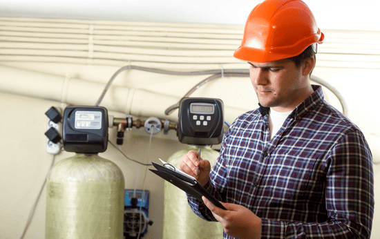 Technician-setting-up-water-purification-system-in-Fergus-ON-residence-LG-Home-Comfort