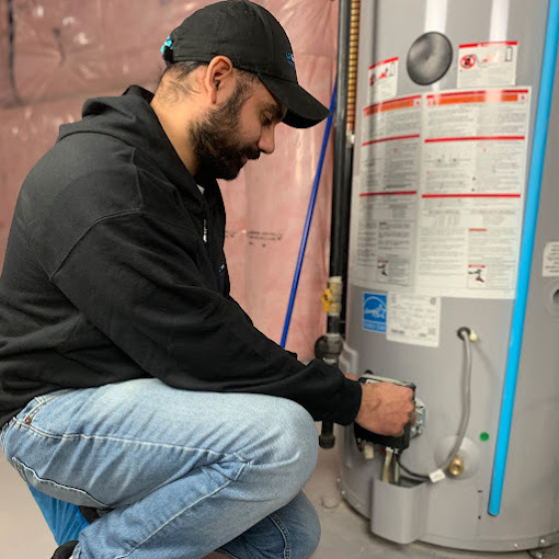 Skilled-technician-repairing-water-heater-system-in-Brampton