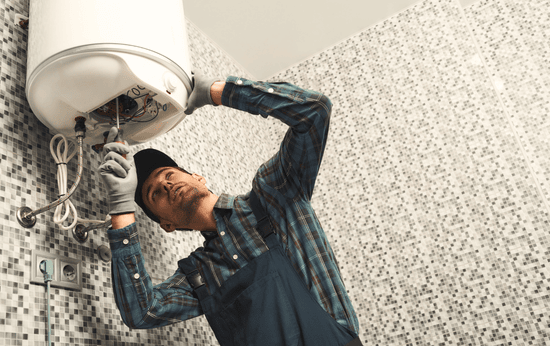 Skilled-professionals-installing-efficient-tank-water-heaters-in-Brampton-ON-LG-Home-Comfort