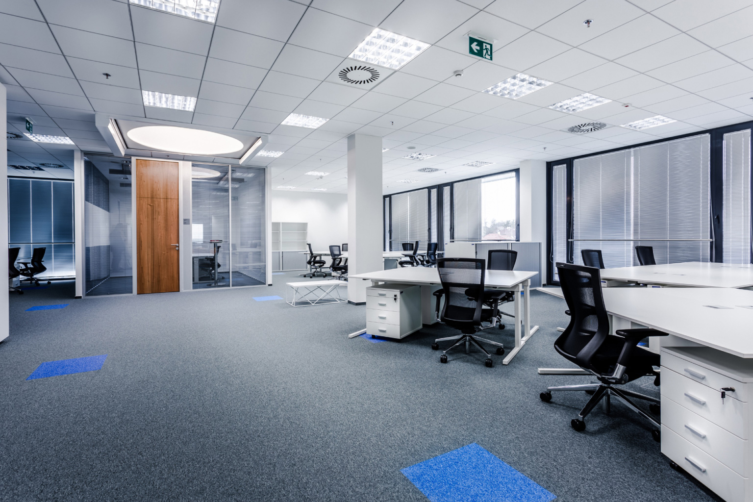 Office space with marked carpet for UFAD diffuser placement