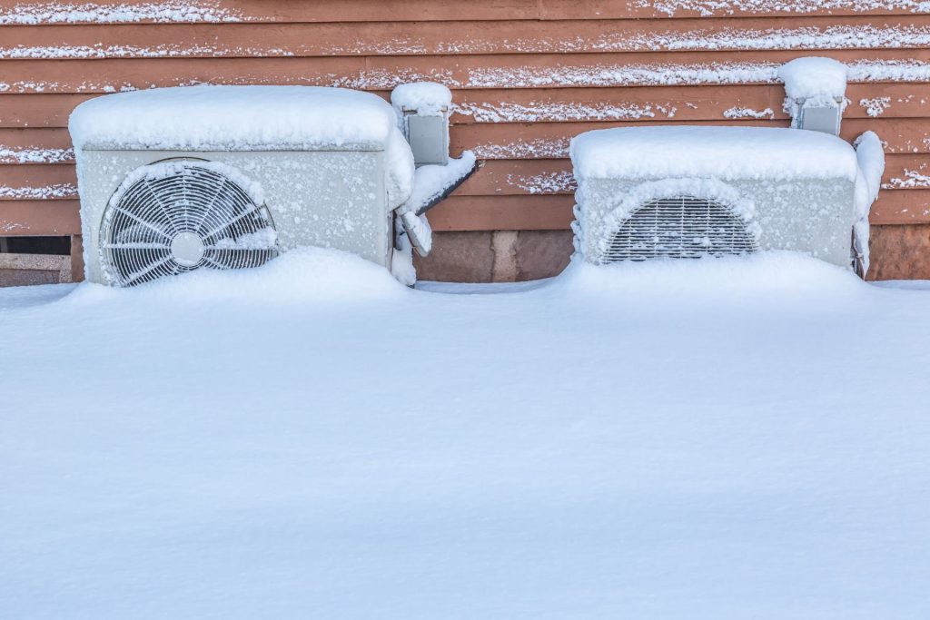 Dual fuel heat pumps buried halfway in snow