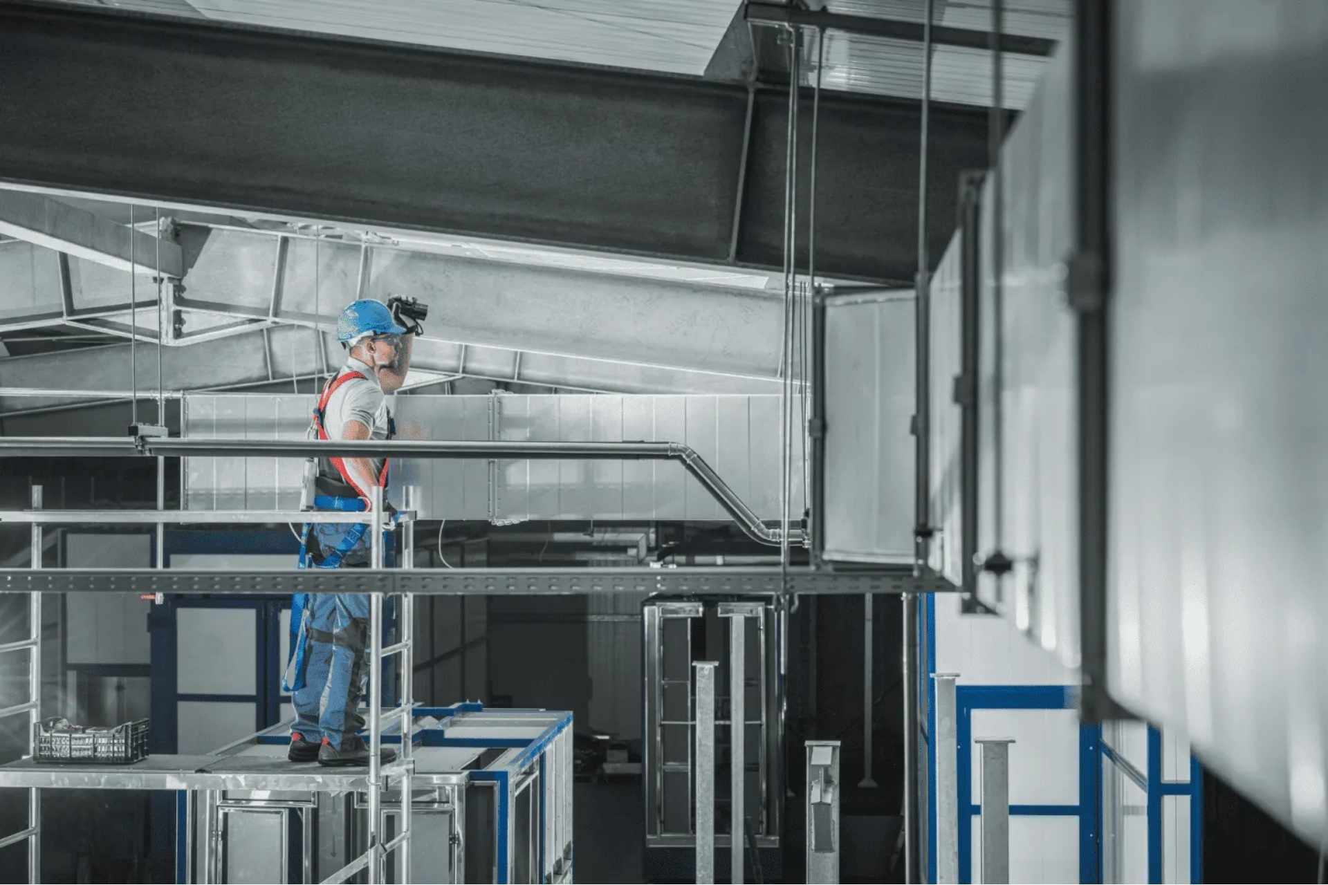 an HVAC contractor inspecting the vents in a commercial building