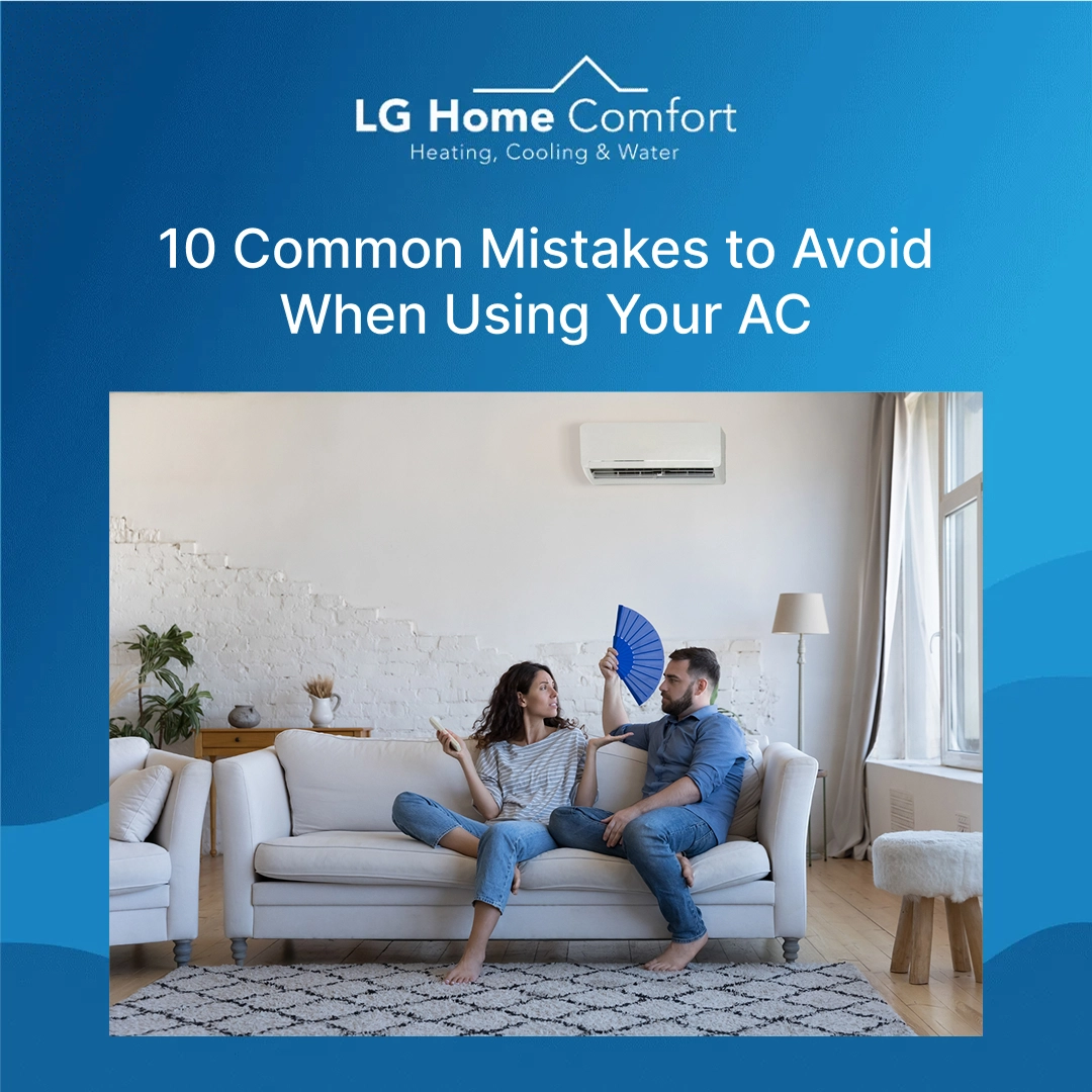 Couple in a couch having AC issue at home, husband using fan to cool himself