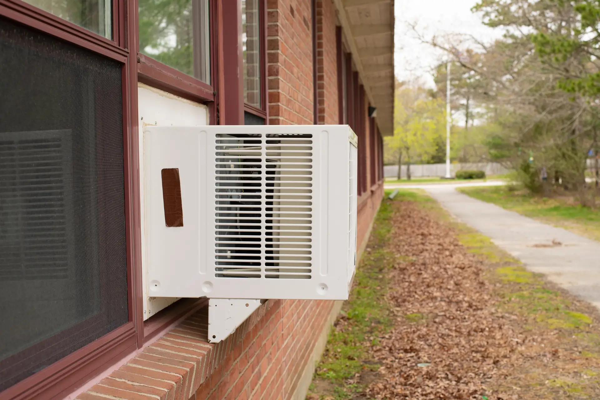 Window AC unit in a brick building