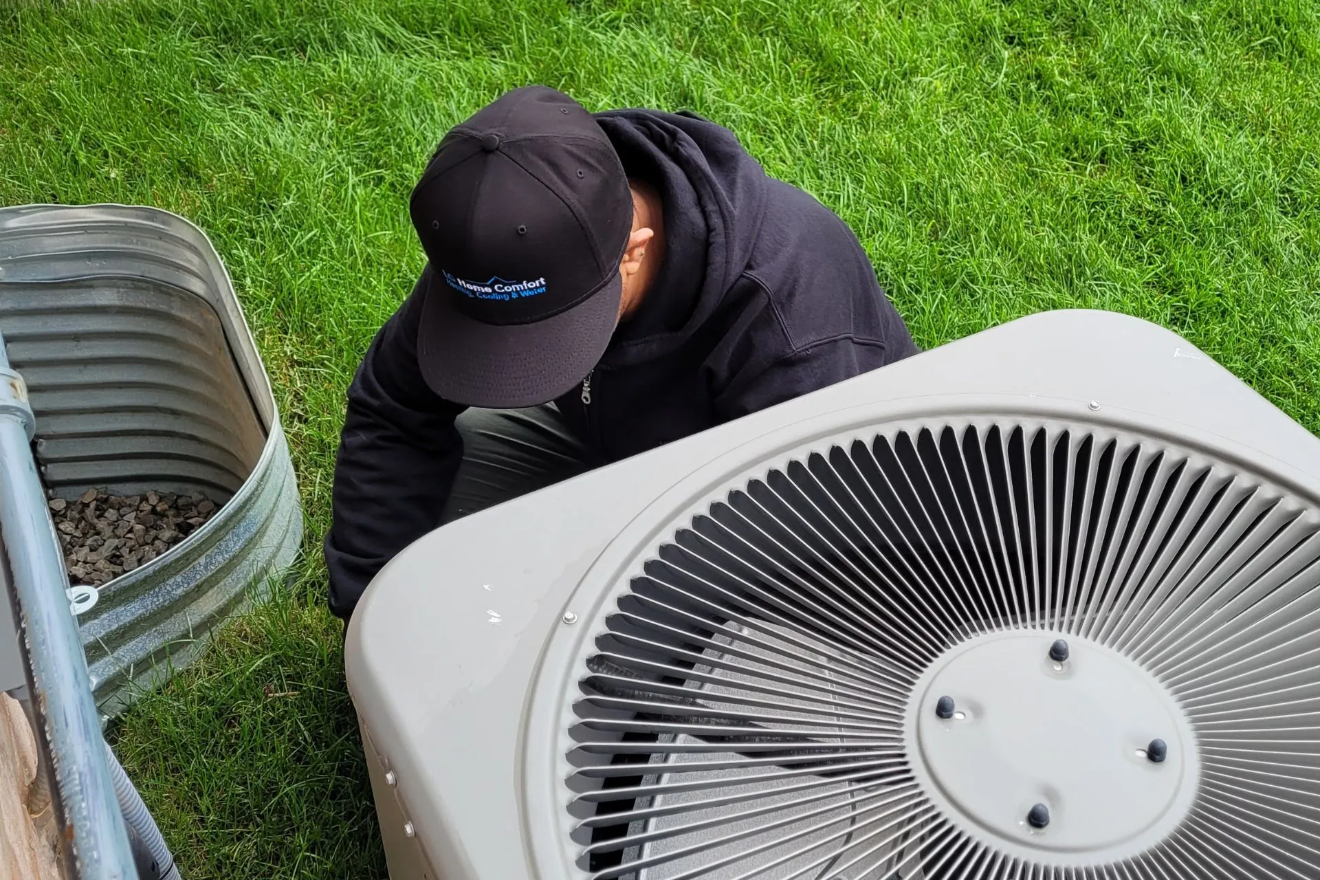 LG Home Care technician preparing heat pump for summer