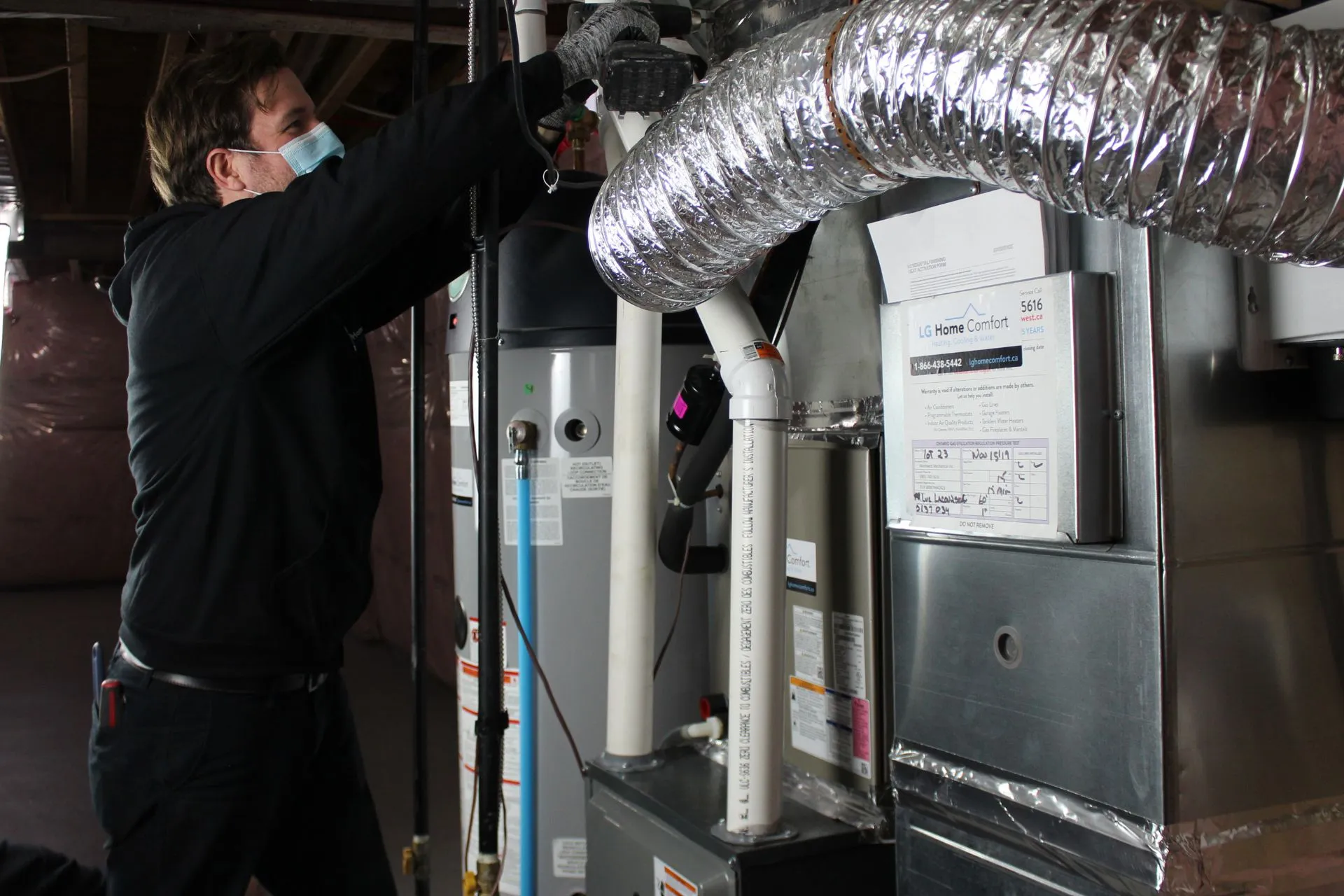 LG Home Comfort technician fixing HVAC coil
