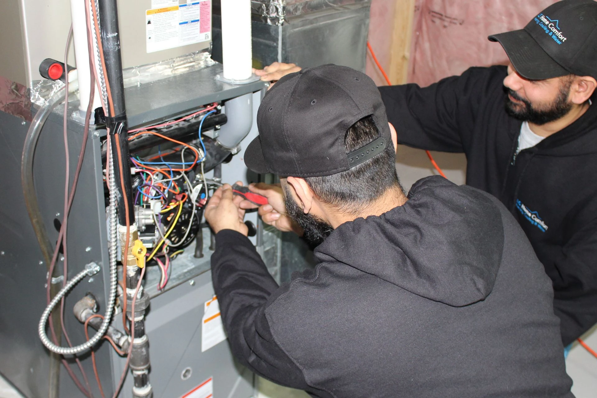 HVAC technician explaining new furnace cost