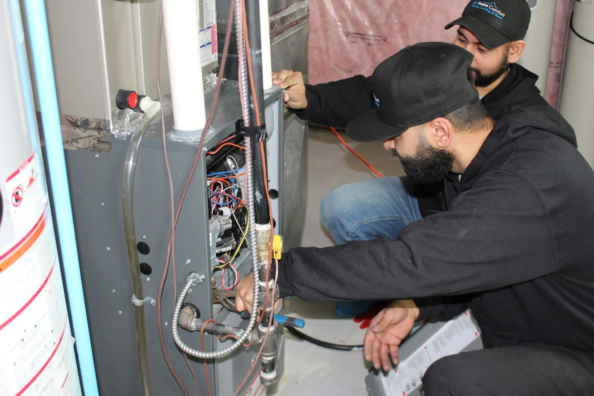 HVAC technicians doing maintenance and repairs